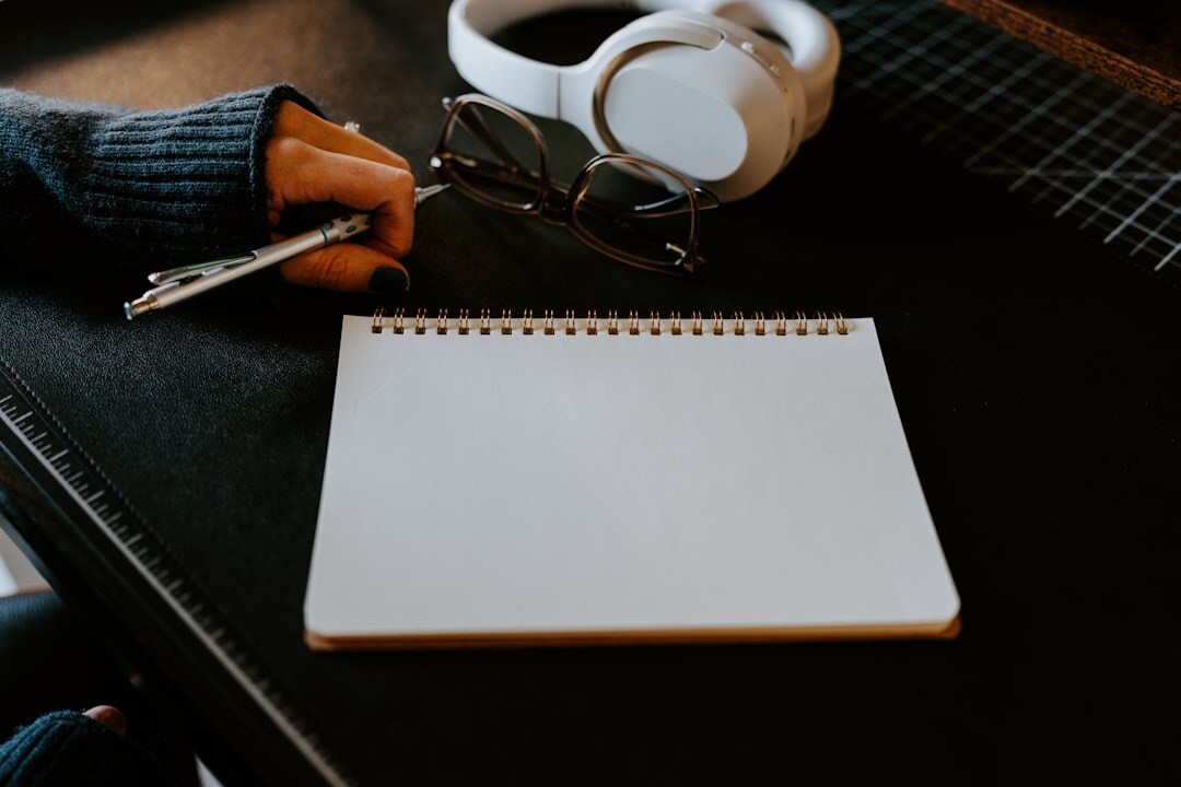 writer at desk with notebook